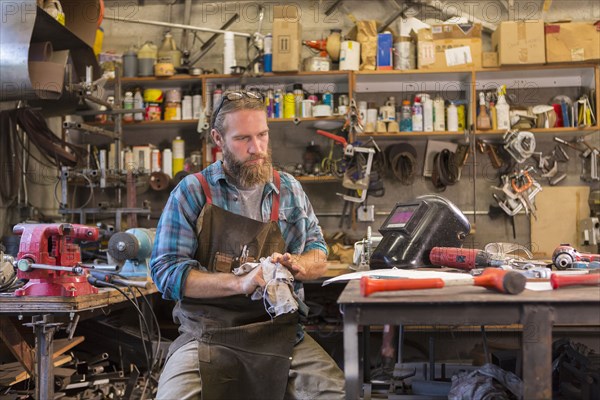 Caucasian craftsman working in workshop