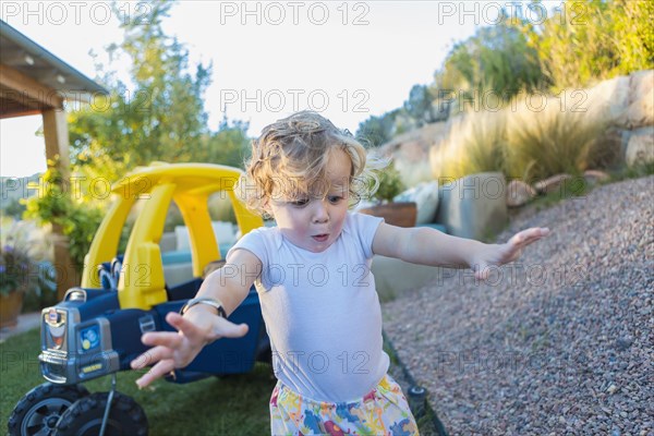 Caucasian boy playing in backyard