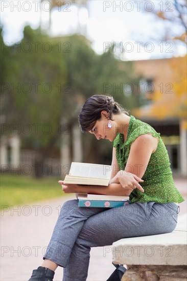 Mixed race student studying on campus