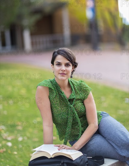 Mixed race student studying on campus