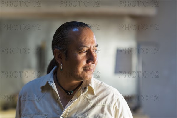 Native American man smiling indoors