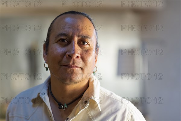 Native American man smiling indoors