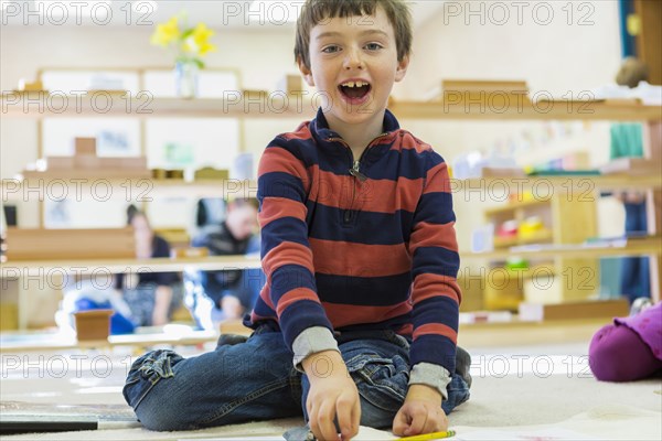 Caucasian boy playing in classroom