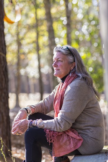 Older Caucasian woman sitting outdoors