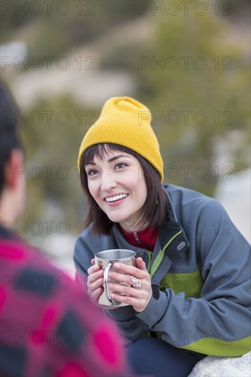 Couple drinking coffee outdoors