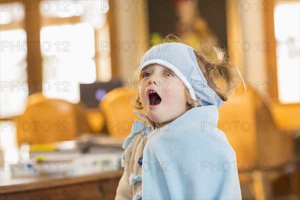 Caucasian boy wearing superhero costume