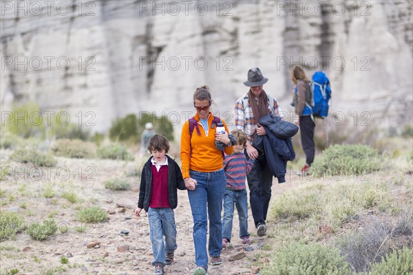 Family hiking on dirt path