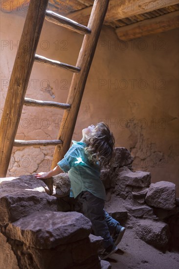 Caucasian girl exploring Native American ruins at Pecos National Monument