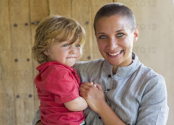 Caucasian mother and baby son smiling