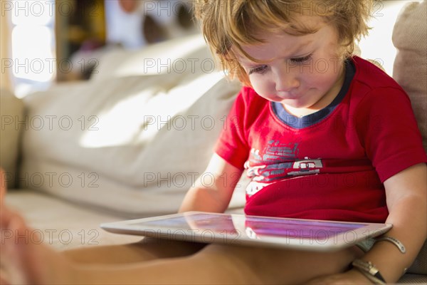 Caucasian boy using digital tablet