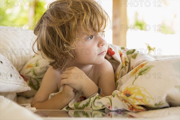 Caucasian boy playing with digital tablet