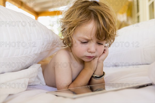 Caucasian boy using digital tablet