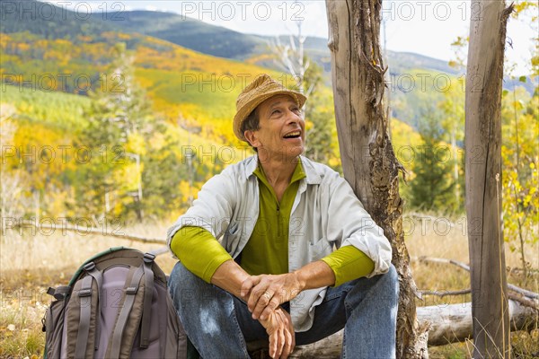 Man admiring autumn forest