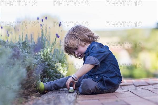 Caucasian boy playing outdoors