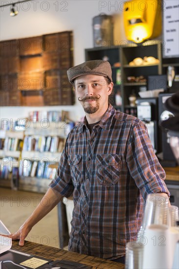 Caucasian barista working in cafe