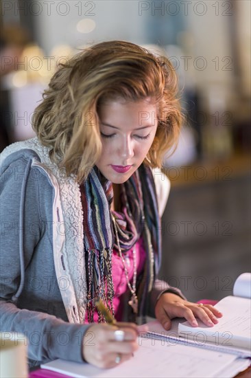 Mixed race student studying at table