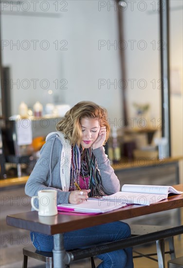 Mixed race student studying at table