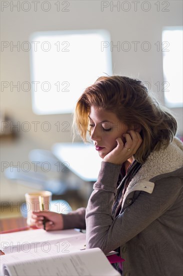 Mixed race student studying at table