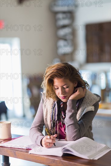 Mixed race student studying at table