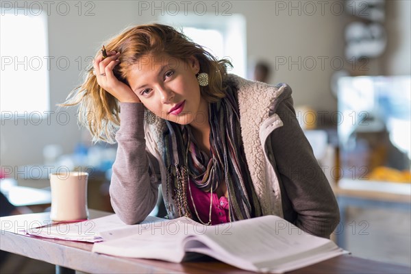 Mixed race student studying at table