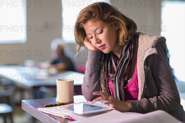 Mixed race student studying at table
