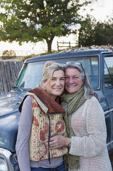 Caucasian mother and daughter hugging