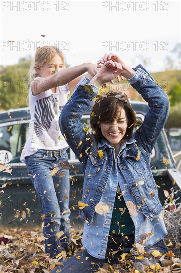 Mother and daughter playing in truck bed