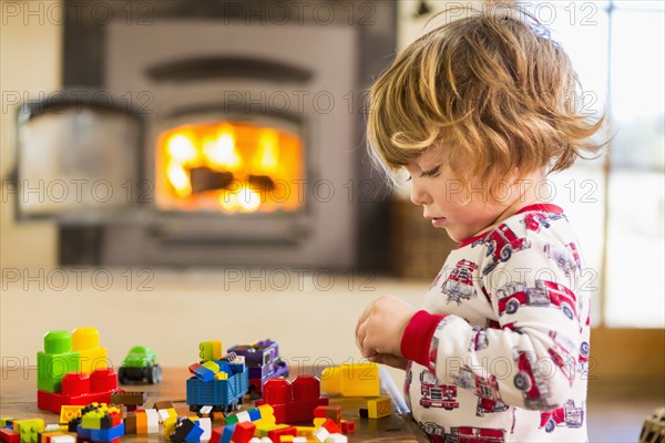 Caucasian boy playing with blocks