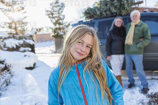 Caucasian girl smiling in snow