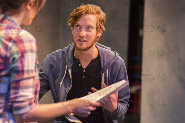 Actors rehearsing on theater stage