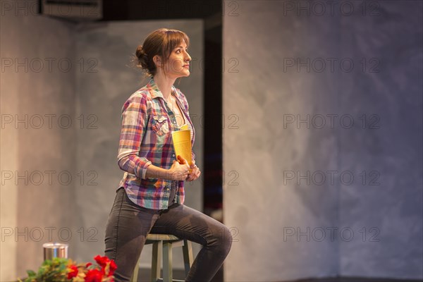 Hispanic actress rehearsing on theater stage