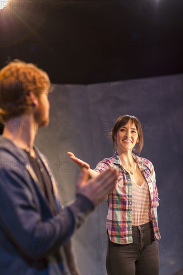 Actors rehearsing on theater stage