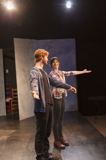 Actors rehearsing on theater stage