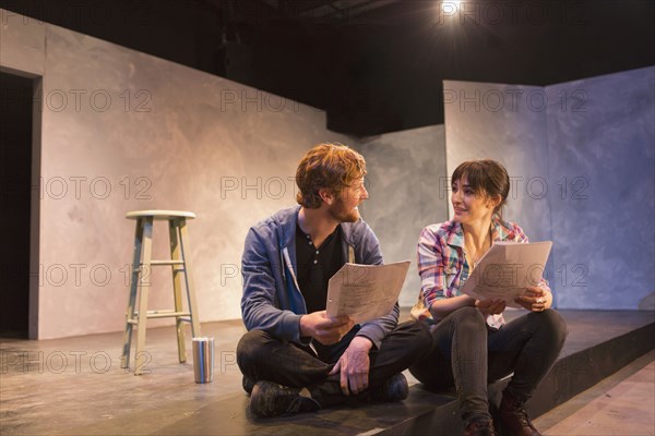 Actors rehearsing on theater stage