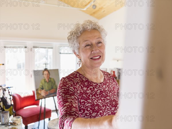 Artist painting in studio