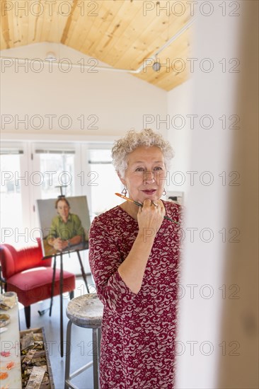 Artist painting in studio