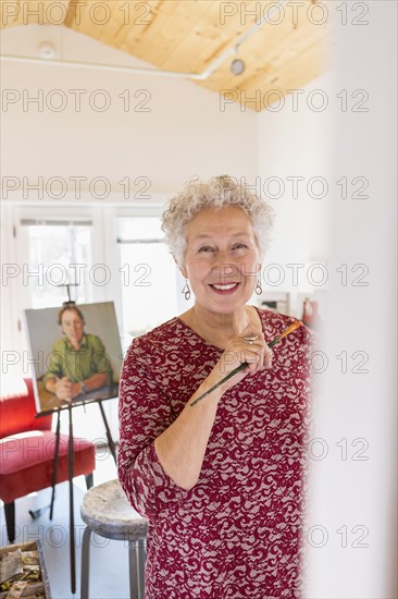 Artist painting in studio