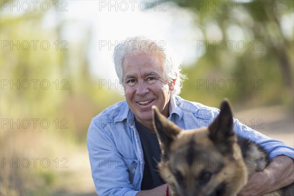 Caucasian man petting dog