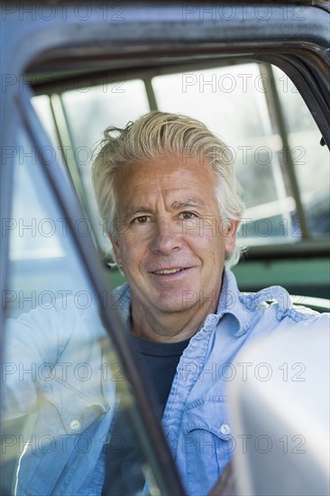 Caucasian man sitting in truck