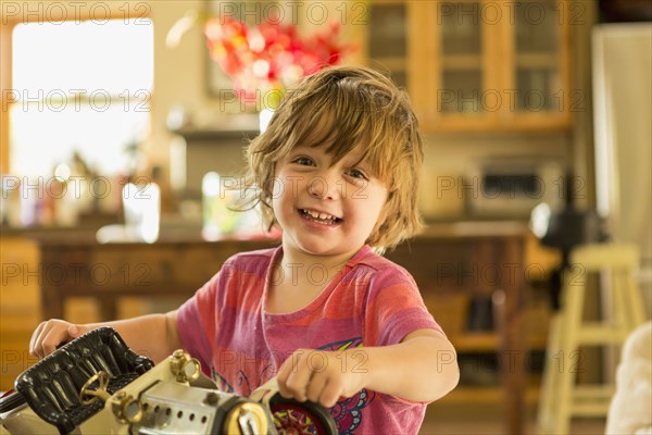 Caucasian boy holding vintage toy car