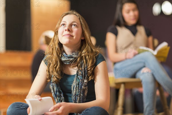 Curious Mixed Race teenage girl in theater class