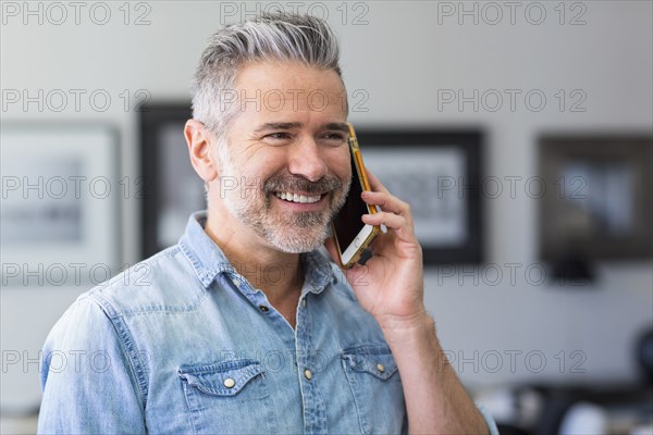 Caucasian man talking on cell phone