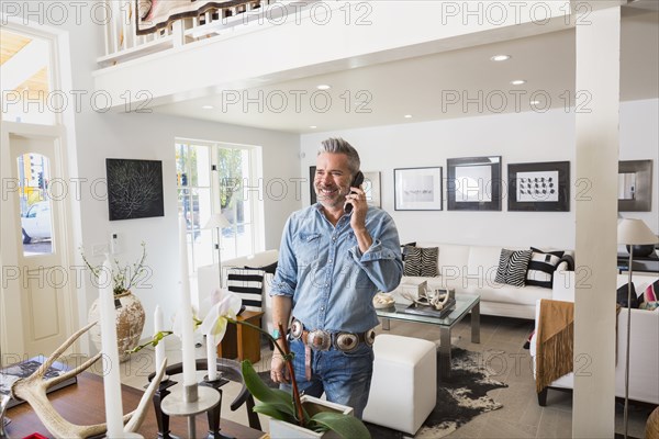 Caucasian man talking on telephone