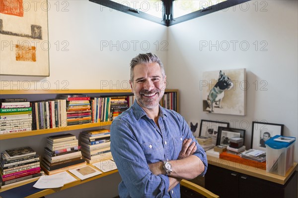 Portrait of smiling Caucasian man in home office