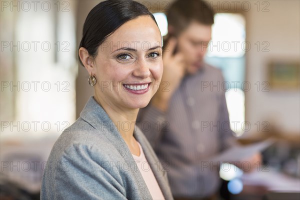 Portrait of smiling Caucasian businesswoman