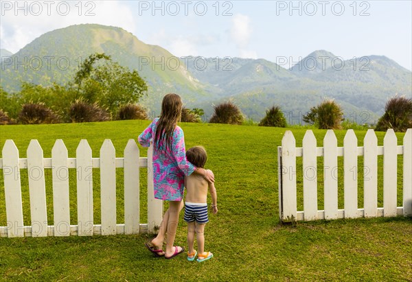 Caucasian brother and sister admiring scenic view of mountains