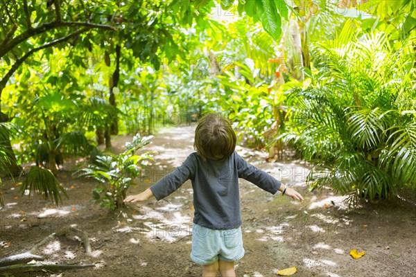 Carefree Caucasian boy standing on path