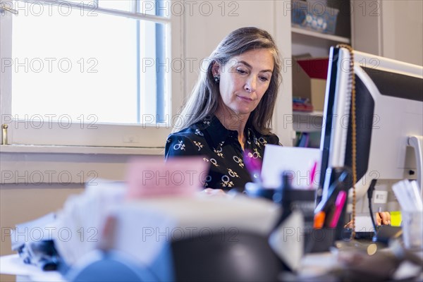 Caucasian businesswoman using computer