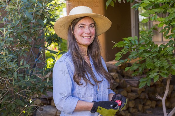 Portrait of smiling older Caucasian woman in the garden