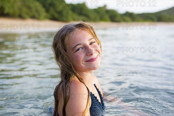 Portrait of smiling Caucasian girl swimming